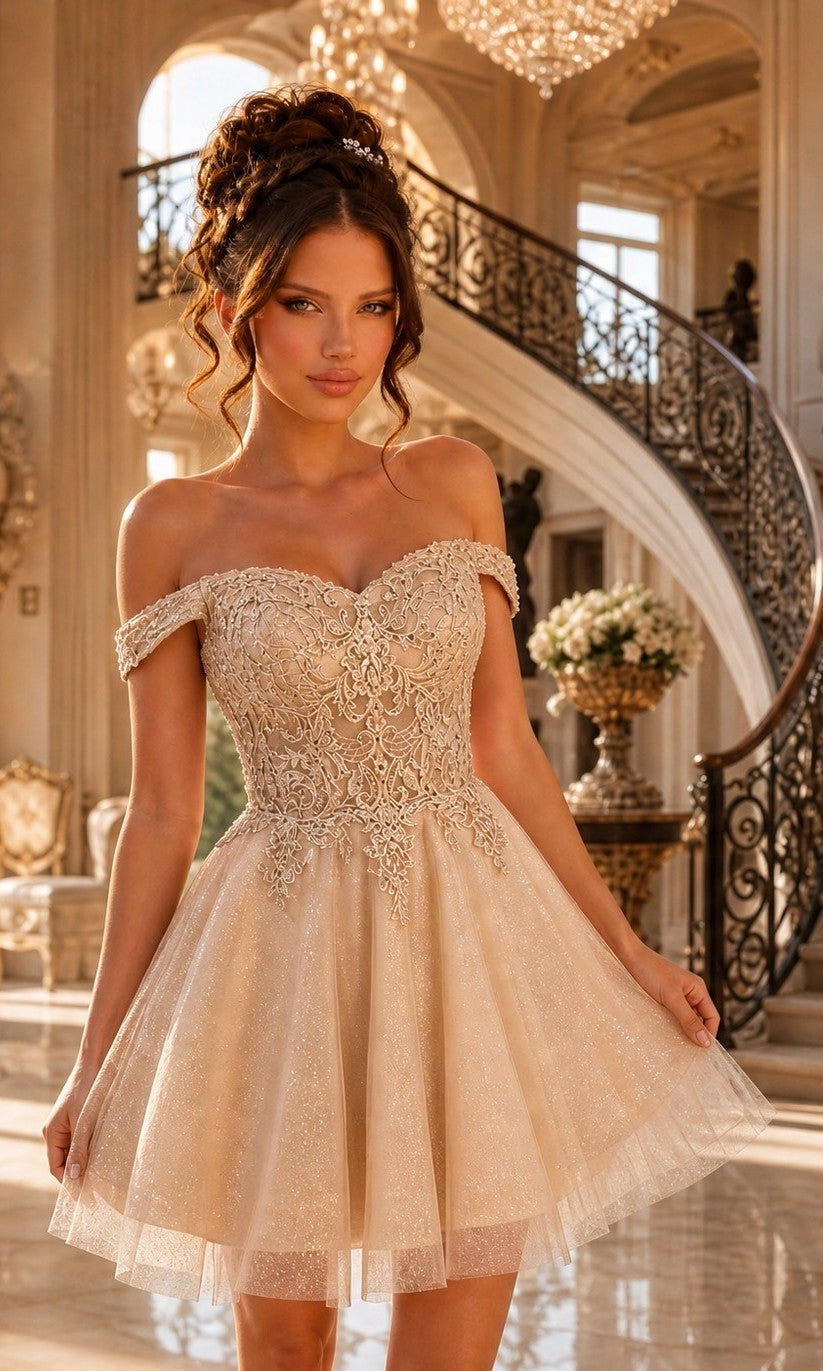 A woman stands in an elegant room beside a sweeping staircase, wearing the Off-Shoulder Short Glitter Homecoming Dress C318 in champagne, its sparkling corset-style bodice shimmering beneath grand chandeliers.